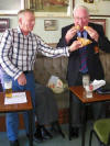 Alec McWhirter feeding pies to Craig McQuade