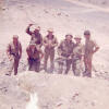 Bill Grant and team drilling holes in the rock for blasting, S/Sgt.  Scoble supervising.
