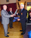 John Donaldson receiving a bottle of malt whisky from Kenny Wratten courtesy of Eoin McIntyre on 20 November 2011