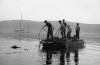 Safety Tug Boat at Rhu on the Firth of Clyde during exercise on Heavy Ferry. circa late 50s Lt. Stewart OC 2 Troop furthest aft on starboard side.