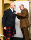 Major General Michael Lawrence Riddell-Webster CBE DSO presenting former Captain Eoghann maclachlainn with the GSM with Clasp South Arabia at Edinburgh Castle on 16 December 2018